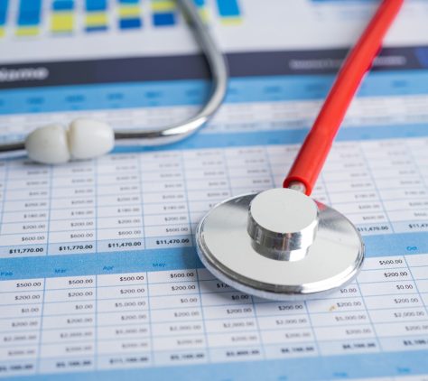 Stethoscope on spreadsheet paper, Finance, Account, Statistics, Investment, Analytic research data economy spreadsheet and Business company concept.